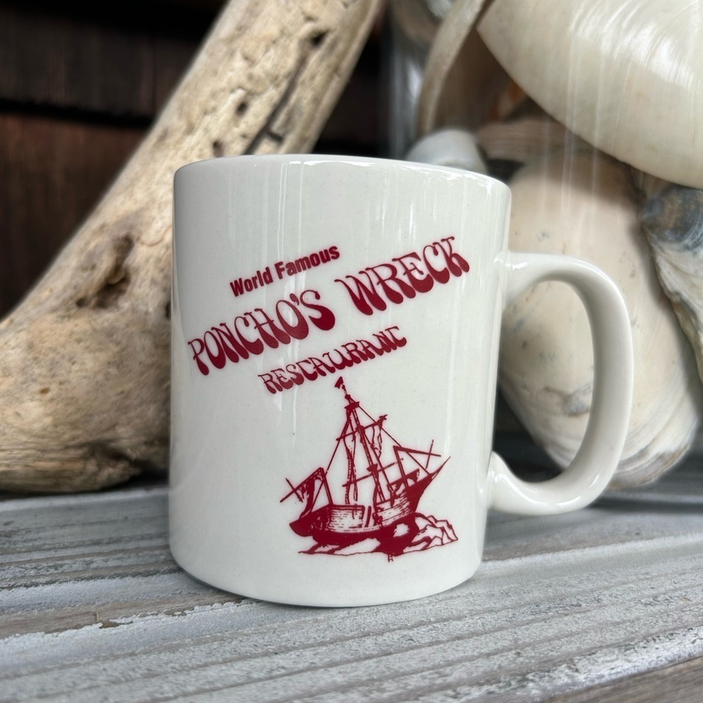 Poncho's Wreck Restaurant White Mug Featuring a Ship Wrecked on the Rocks.